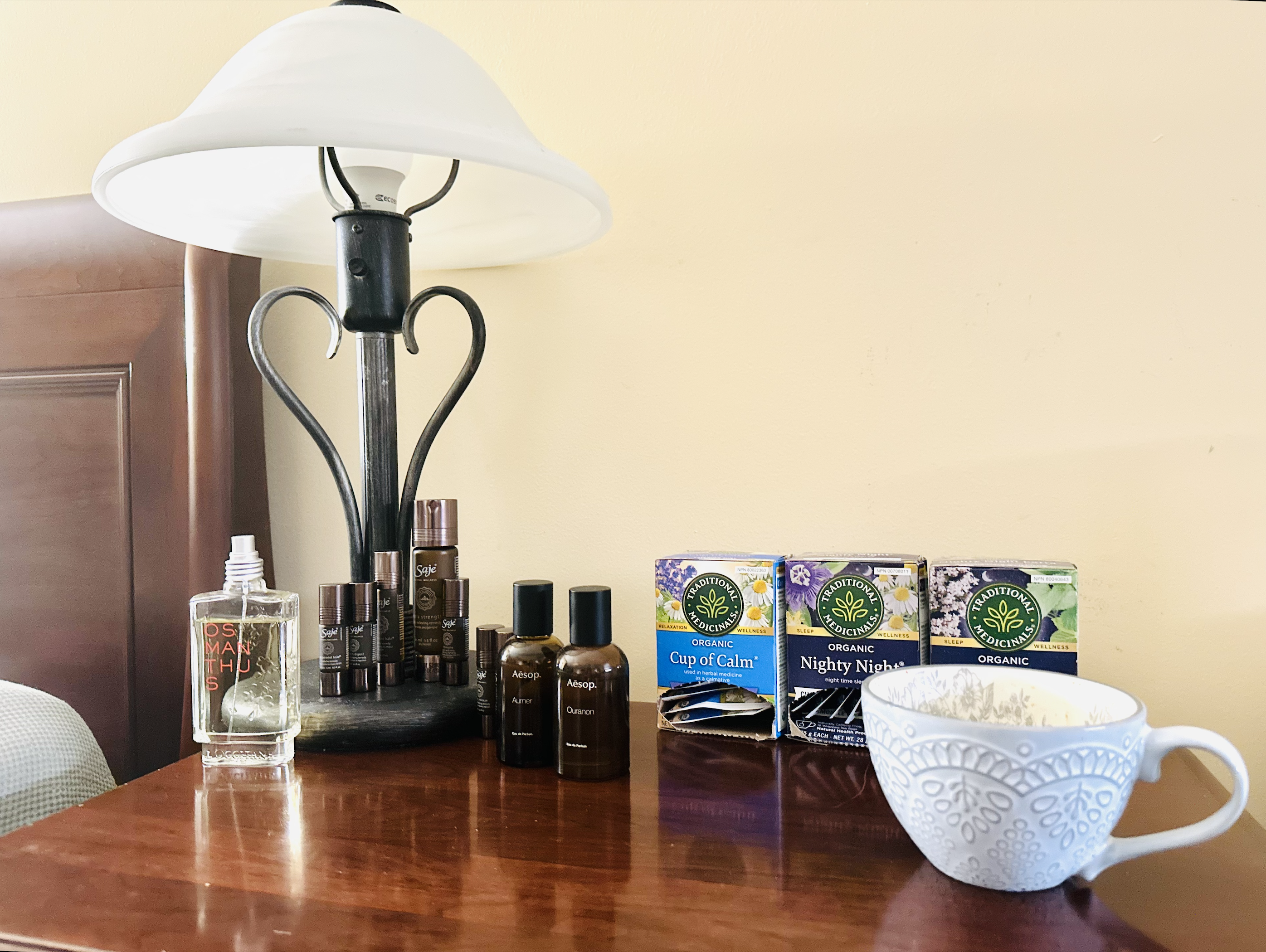A perfume I use before sleeping placed on my bedside next to my nighttime tea