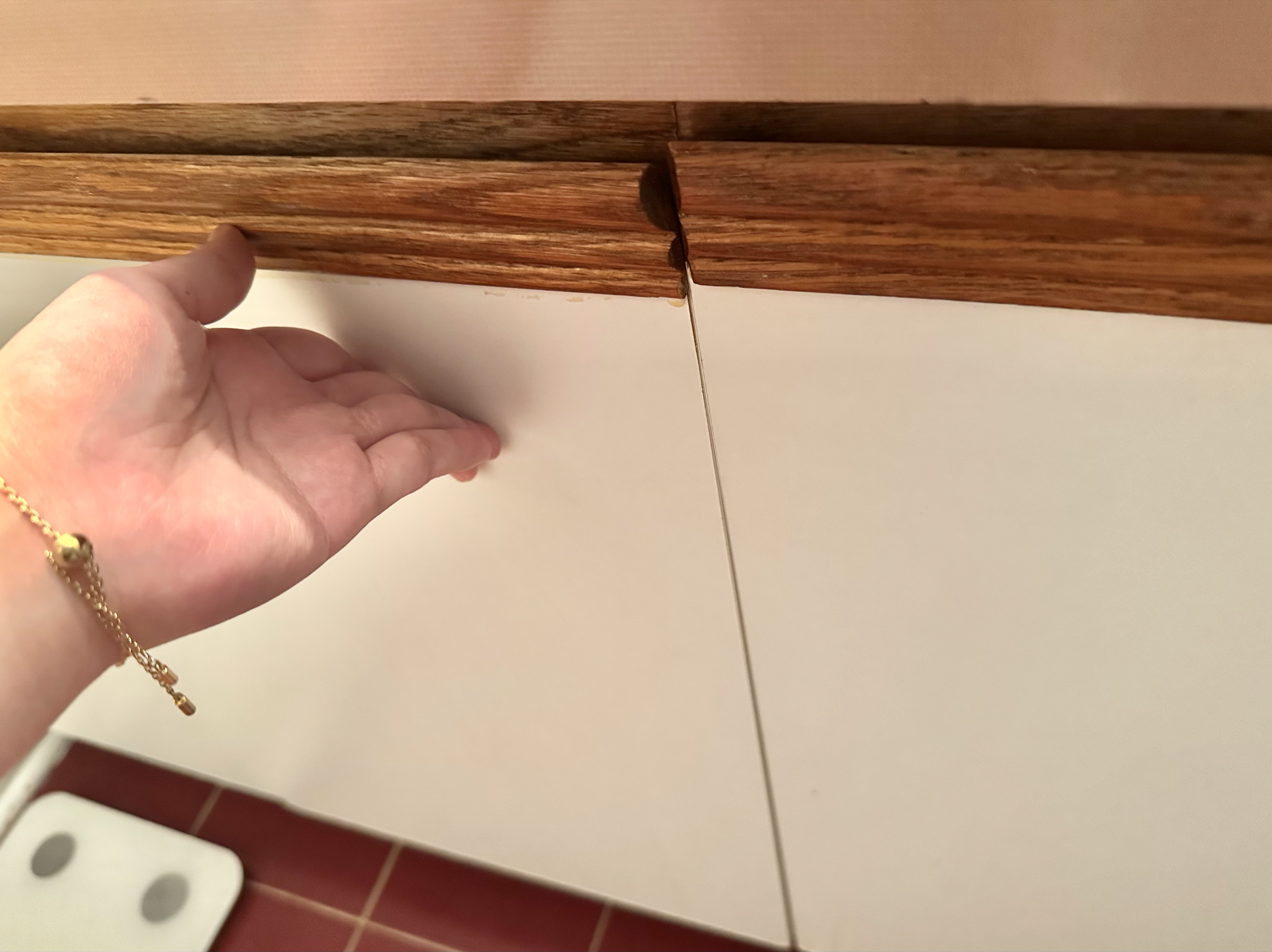 Pushing the cabinet door firmly until it is completely closed